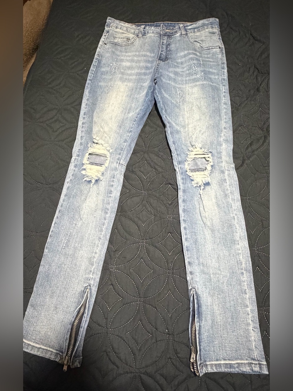 Women’s Light Blue Distressed Knee Zip Hem Jeans